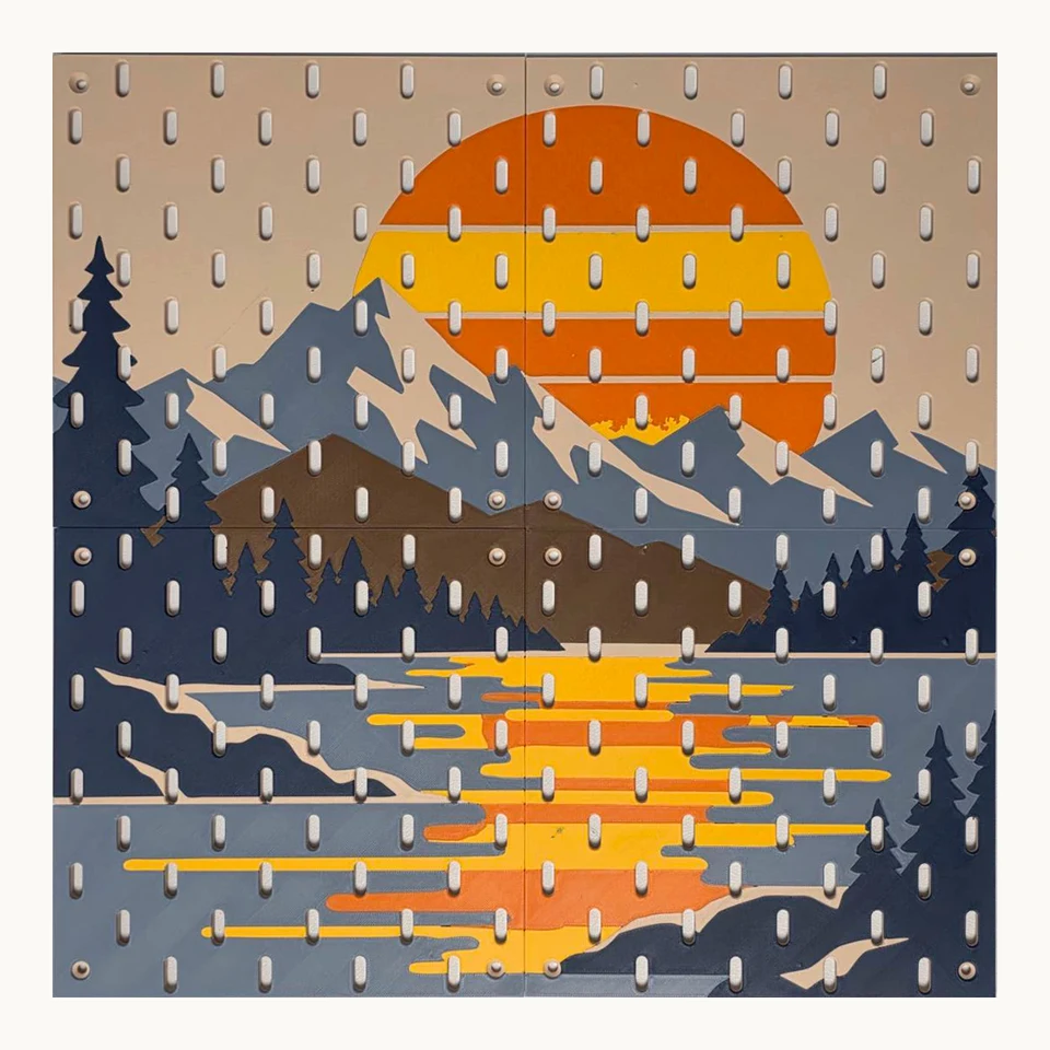 Four six-color printed pegboard panels forming a sunset above mountains, pine trees and lake reflections